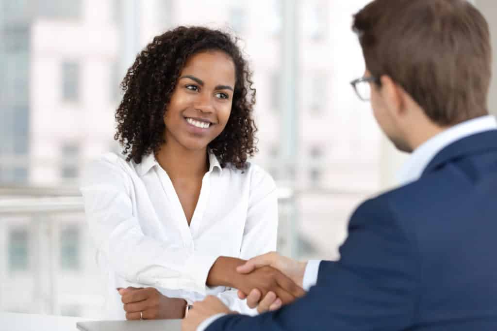 hr manager handshake hire candidate at job interview